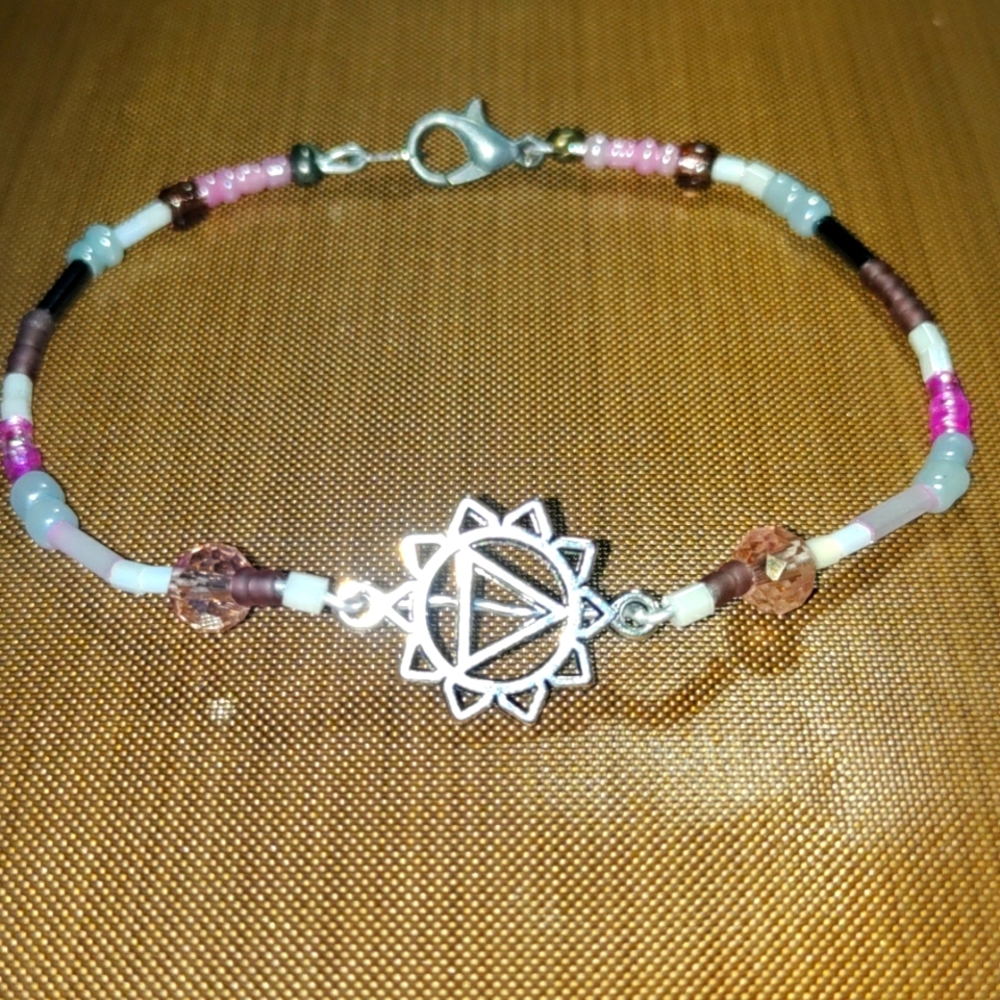 Beaded bracelet with charm